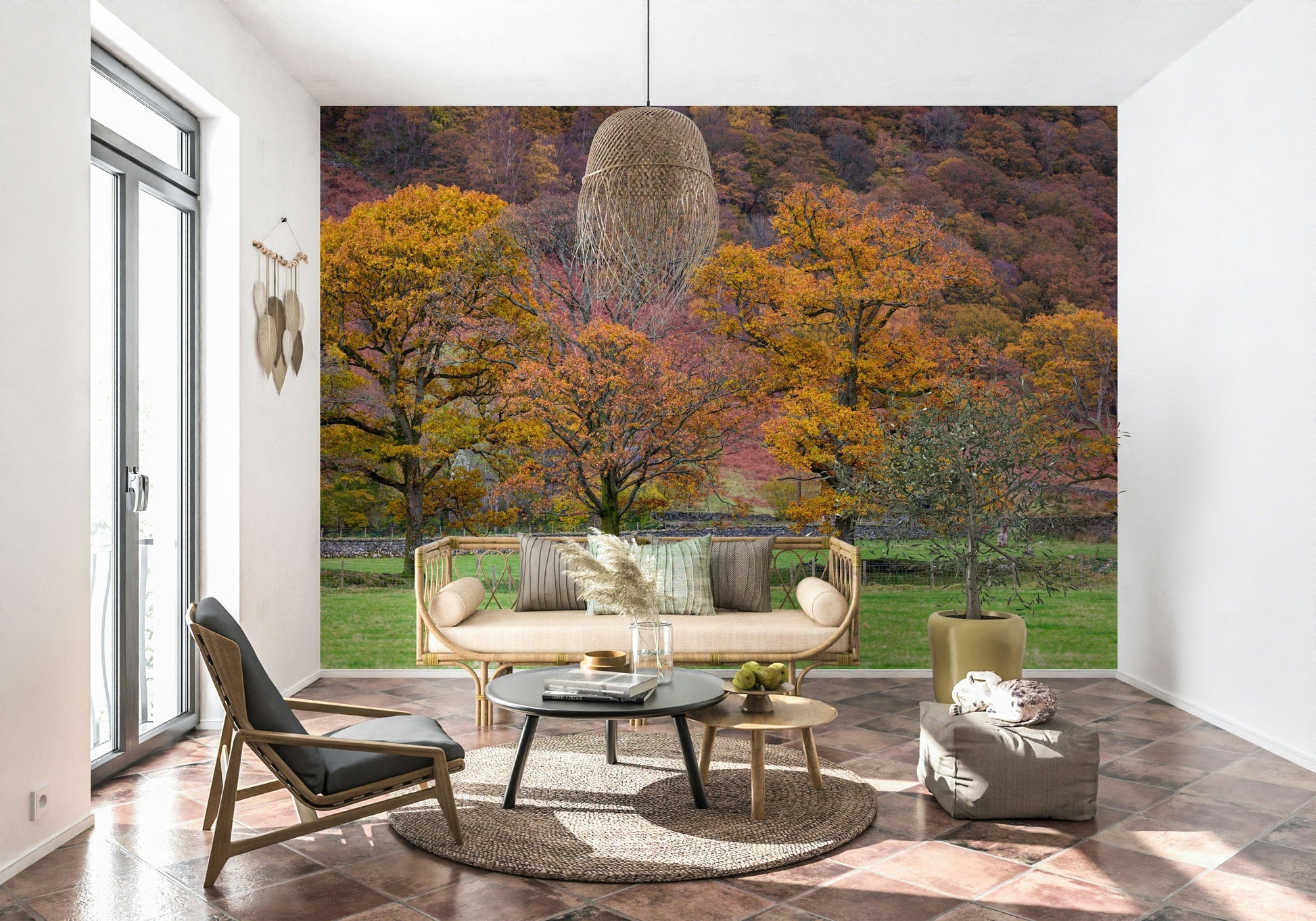 Golden-leafed oak trees set against a colorful hillside create a soothing autumn wallpaper.