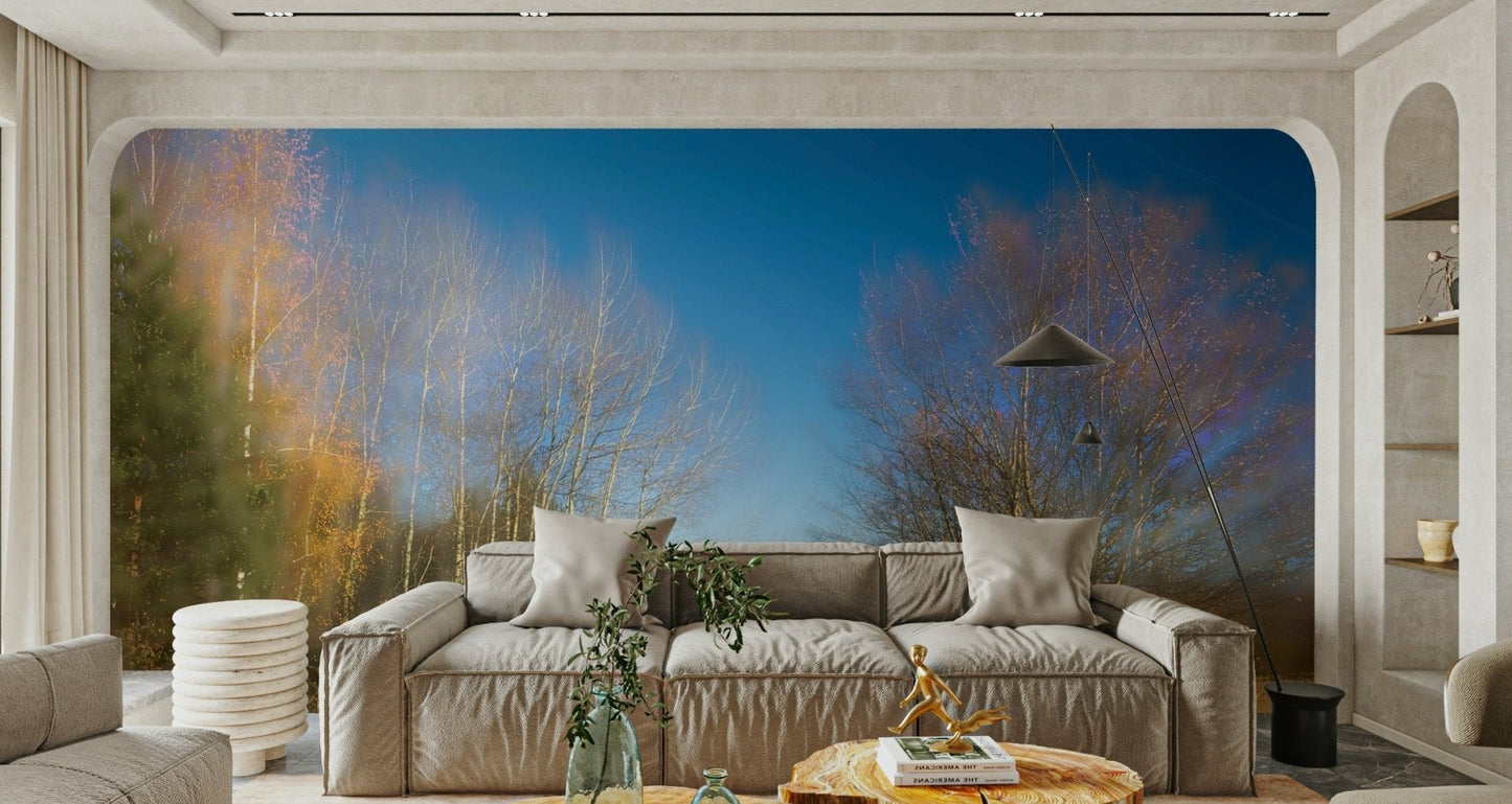 A photo-realistic wall mural of an autumn landscape in a light-filled room.

