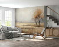 Autumn Vista wallpaper mural of a golden meadow and autumn tree behind a grey sofa and cane sideboard by a staircase