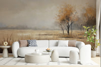 Autumn Vista wallpaper mural of an orange-leaved tree over a field behind a white curved sofa and ottoman in a living room