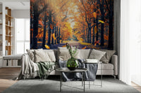 Autumn forest wallpaper showing a golden tree-lined path with fallen leaves