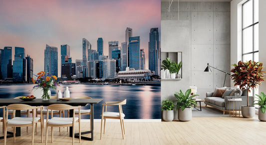 Azure Metropolis wallpaper mural of a pink-sky waterfront skyline above a dining table beside a grey sofa lounge