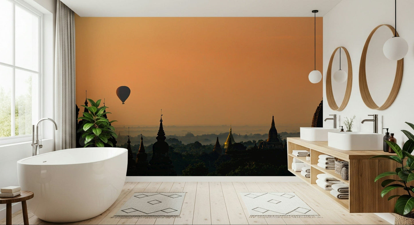 Wallpaper depicting Bagan’s pagodas silhouetted against a warm, early morning sky.