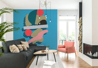 A playful geometric wallpaper combining colorful rounded forms with dotted textures over a blue base.