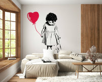 Balloon Girl Art wallpaper mural of a girl with a red heart balloon behind a cream sectional and window seat