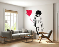 Balloon Girl Art wallpaper mural of a girl and red heart balloon behind a grey sofa and wood-frame armchair
