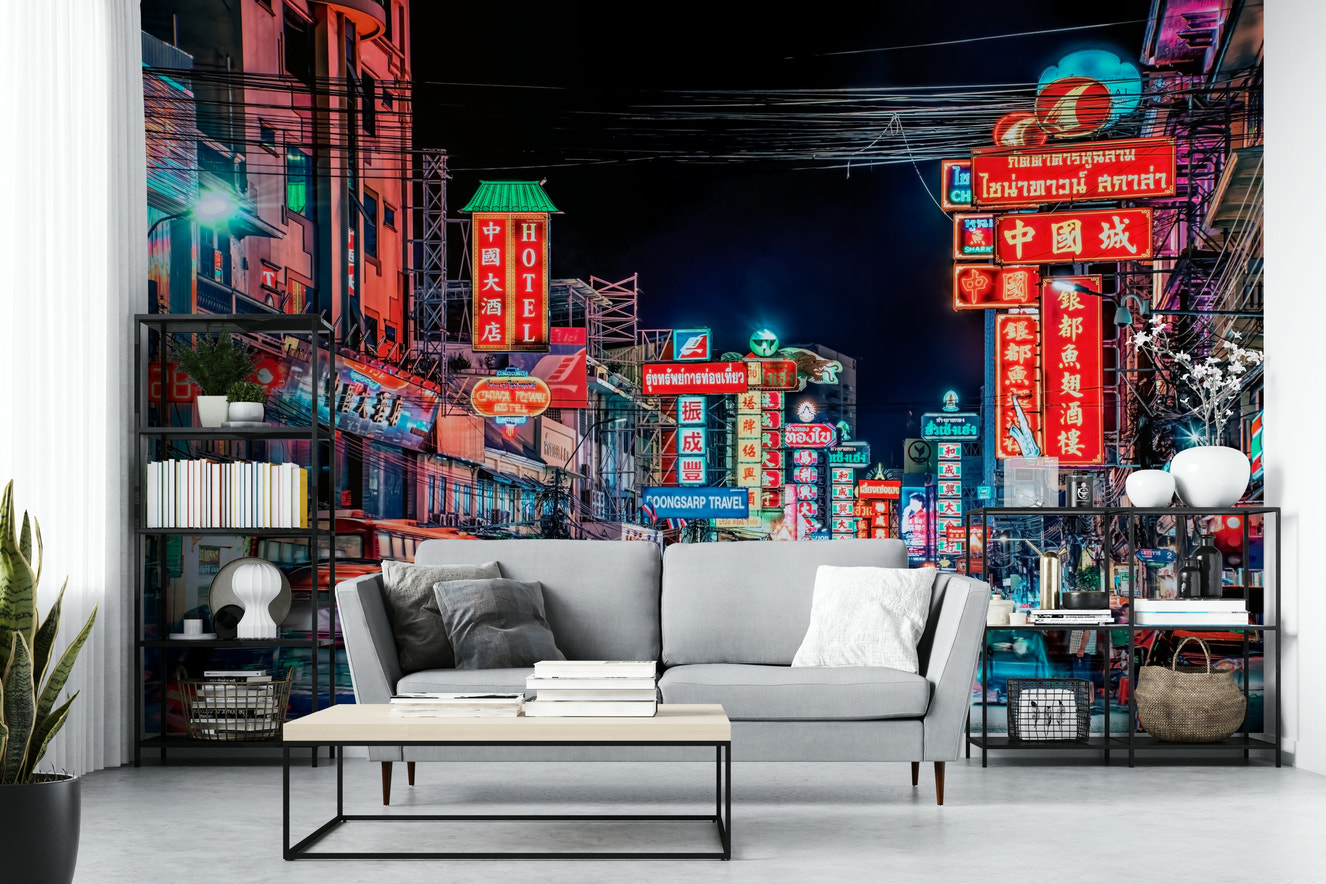 Bangkok street glowing with neon at night

