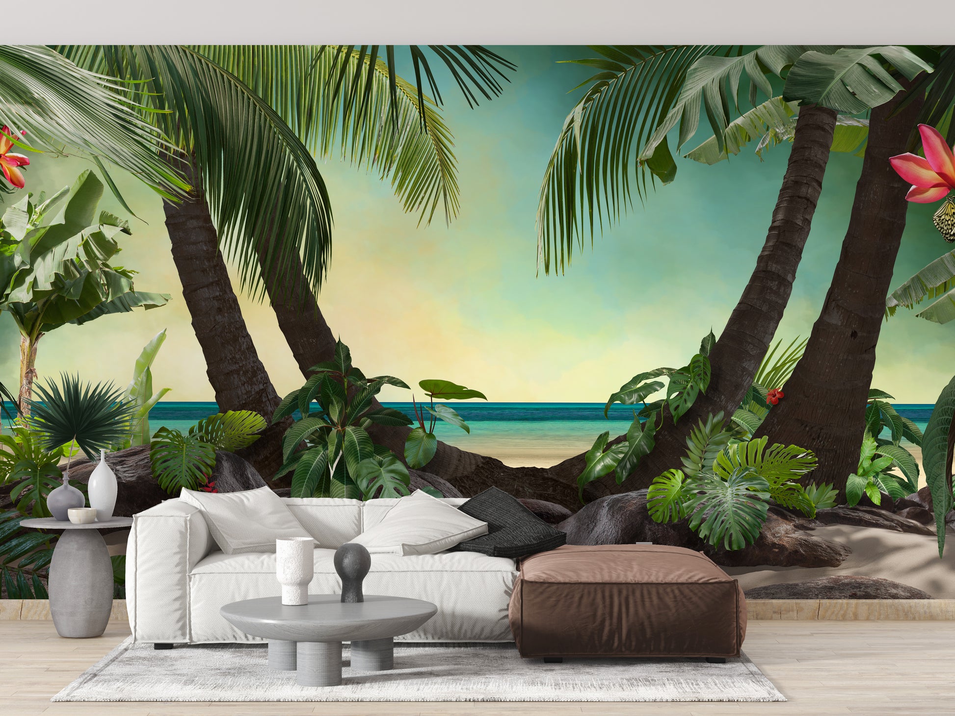 Beach Lagoon View wallpaper mural of tropical palms behind a white sofa and brown leather ottoman