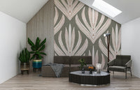 Desert Bloom Echo wallpaper featuring large stylized botanical motifs in soft pink and cream on a muted olive background.