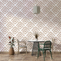 A full-wall mural showing a pattern of painted ornaments.
