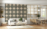 Repeating pattern of soft green circular shapes with a woven texture on an off-white backdrop