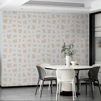 The background of the wallpaper is a warm, creamy off-white.
