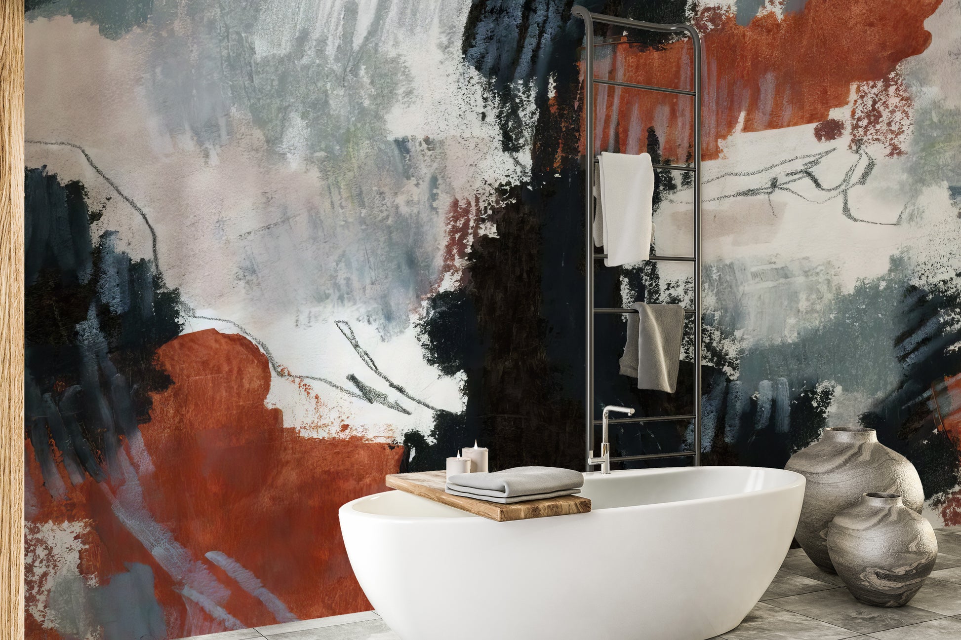 Brushstroke Art wallpaper mural in rust orange and navy behind a white freestanding bathtub and ceramic vases in a bathroom