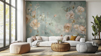 Delicate Blooming Flower mural with blush blooms on a muted green wall above a white sofa in a bright living room