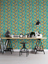 Big Bold Wildflowers Green wallpaper as a full-wall mural behind a trestle desk and stool in a home office