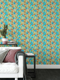 Big Bold Wildflowers Green wallpaper by a white sofa with pink cushion and a potted cactus side table