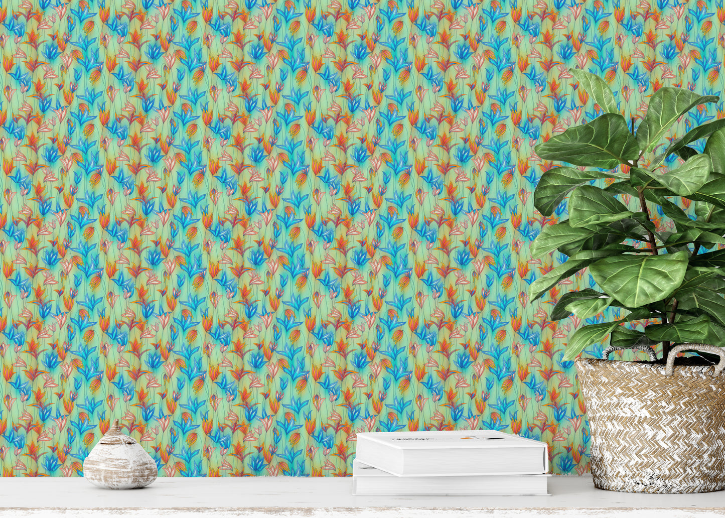 Big Bold Wildflowers Green wallpaper close-up showing the blue and orange floral pattern beside a fiddle-leaf plant