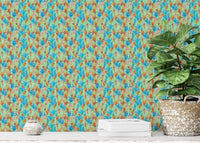 Big Bold Wildflowers Green wallpaper close-up showing the blue and orange floral pattern beside a fiddle-leaf plant