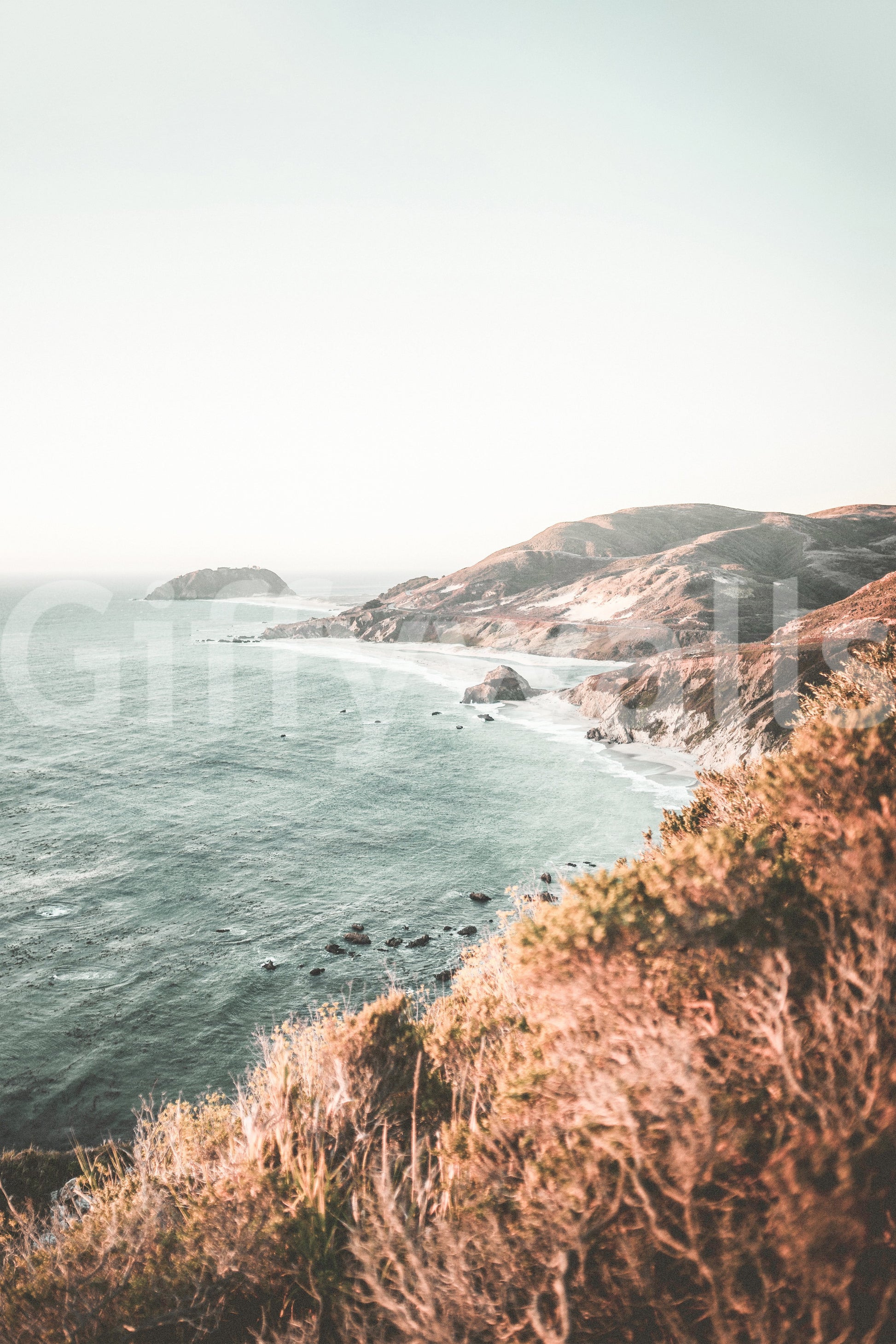 Big Sur coast view wall mural with dramatic cliffs and ocean.

