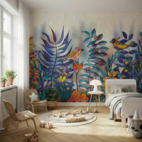 Enchanted Birds Forest wallpaper mural in a child's bedroom with rattan chairs, colorful birds and blue foliage