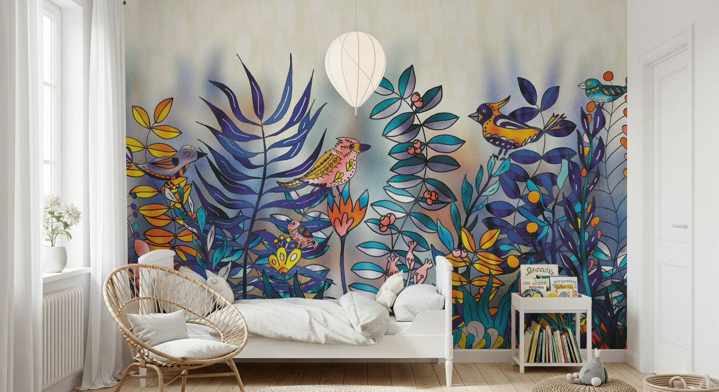 Enchanted Birds Forest wallpaper mural behind a white daybed with rattan chair, vivid birds and blue ferns on the wall