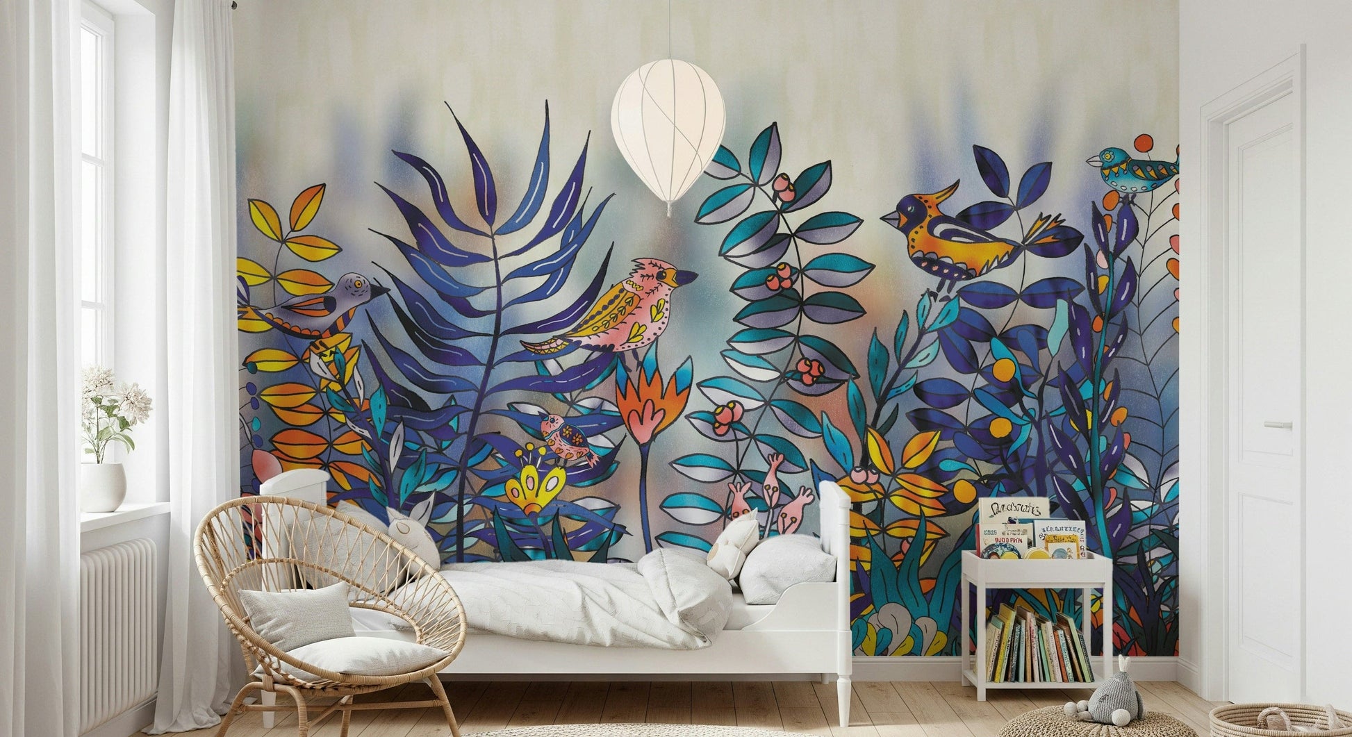 Enchanted Birds Forest wallpaper mural behind a white daybed with rattan chair, vivid birds and blue ferns on the wall
