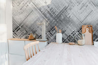 Abstract Diagonal Lines wallpaper mural in grey above white cabinets and a wood counter in a bright kitchen