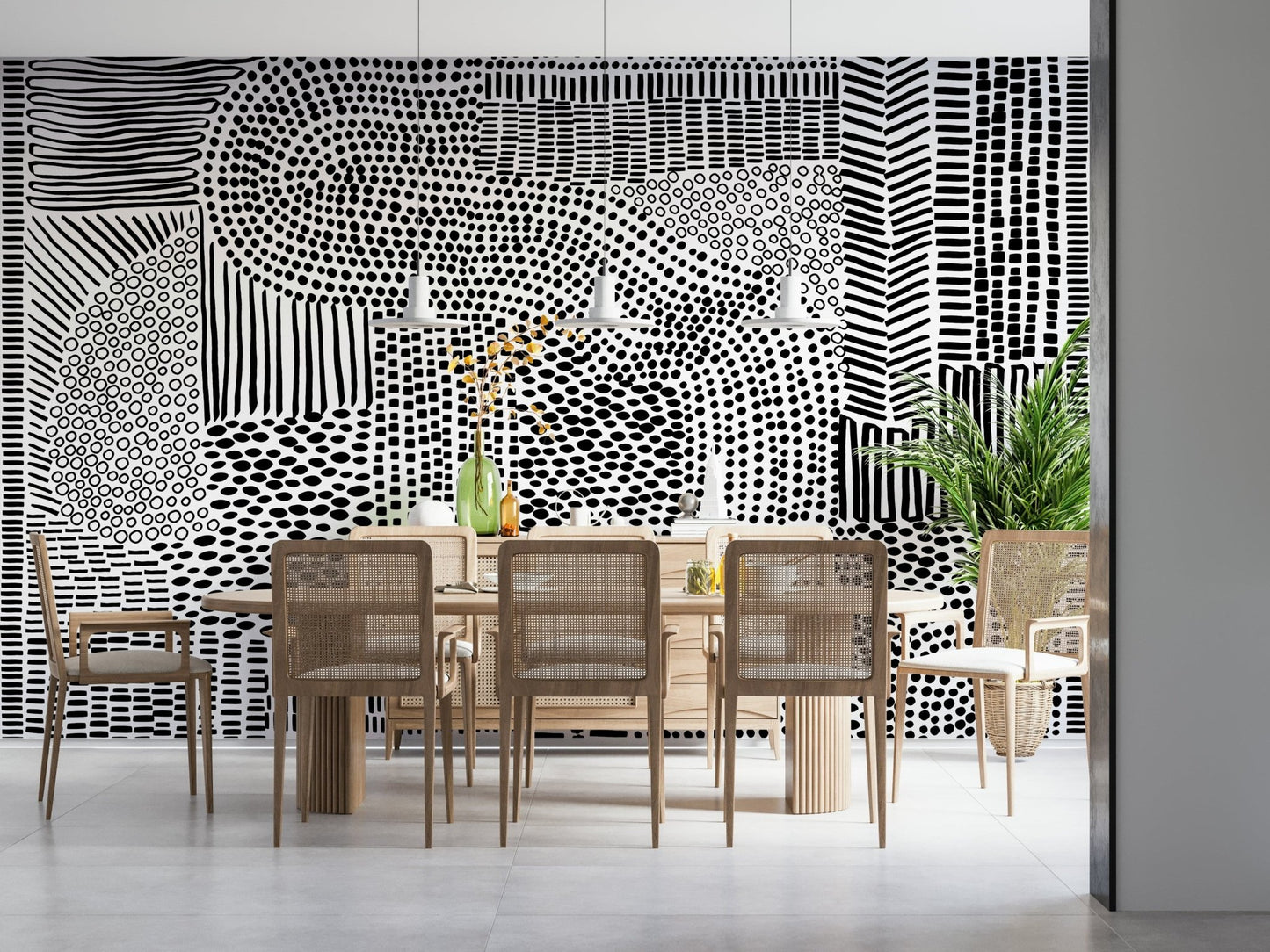 Black And White Maze wallpaper mural behind a wood dining table and cane chairs in a bright room