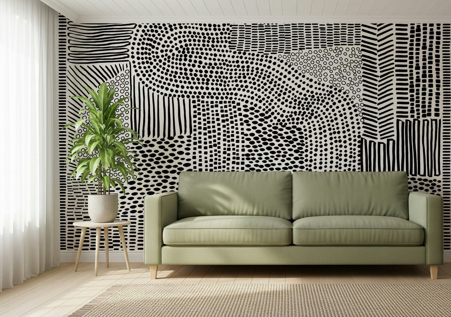 Black And White Maze wallpaper mural behind a sage green sofa and potted plant in a living room