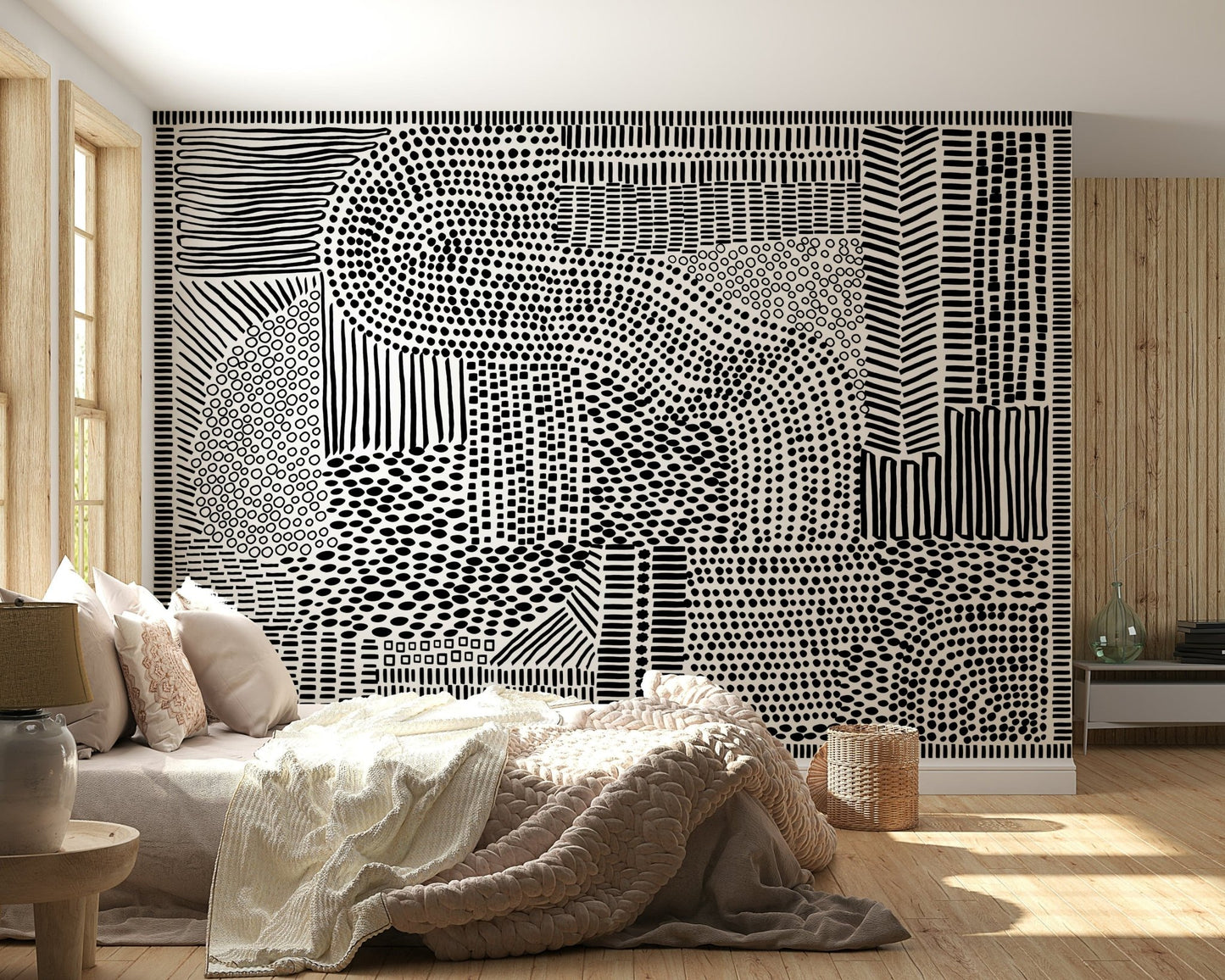 Black And White Maze wallpaper mural behind a cream bed with a knit throw and wood walls