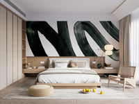 Black Brush Stroke wallpaper mural with black painterly swirls on white above a low wood platform bed and paper lantern