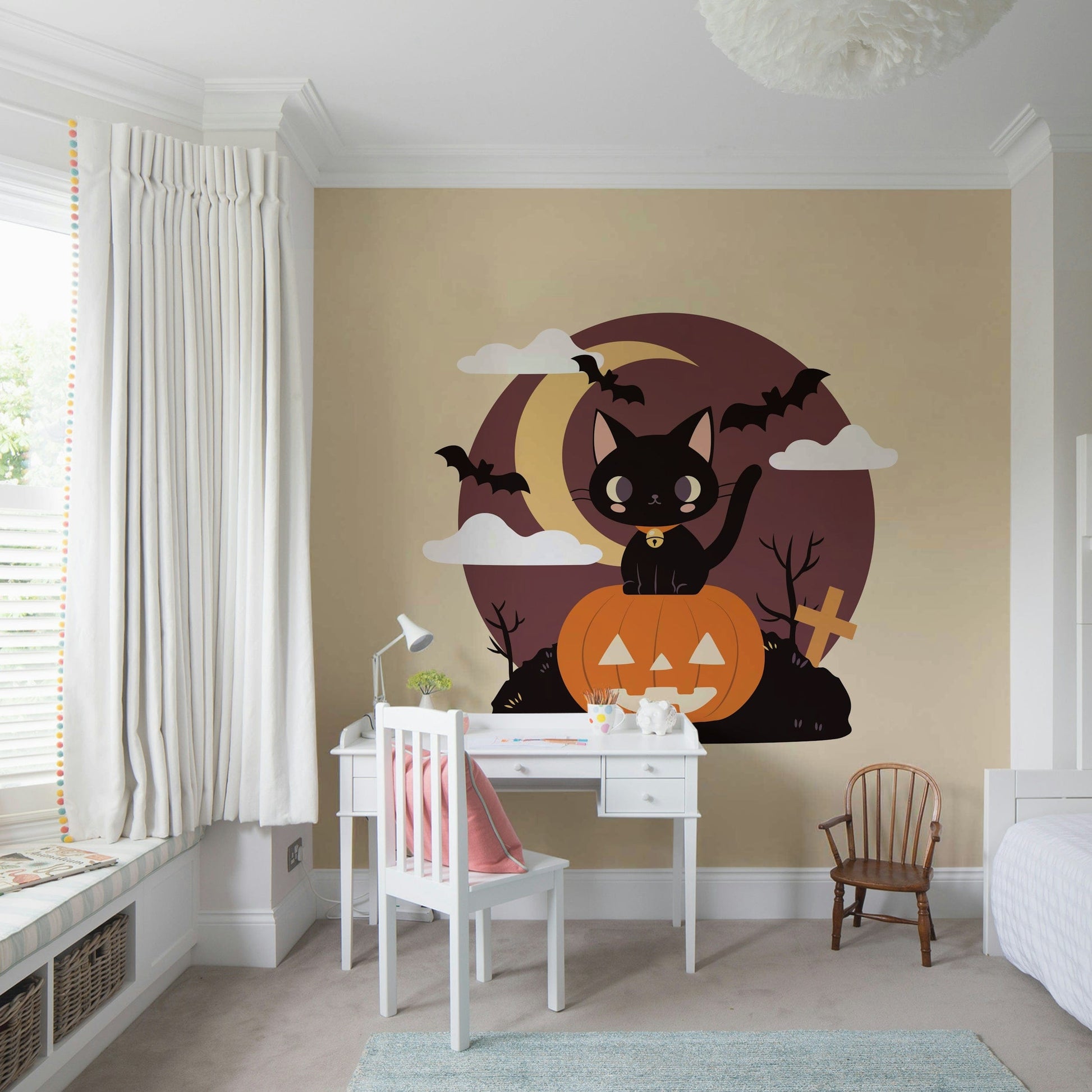 Living room wall decorated with a spooky black cat wall decor for Halloween.
