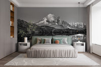 Black & White Landscape Mountain wallpaper mural styled as a feature wall behind a dining table and chairs in black and white