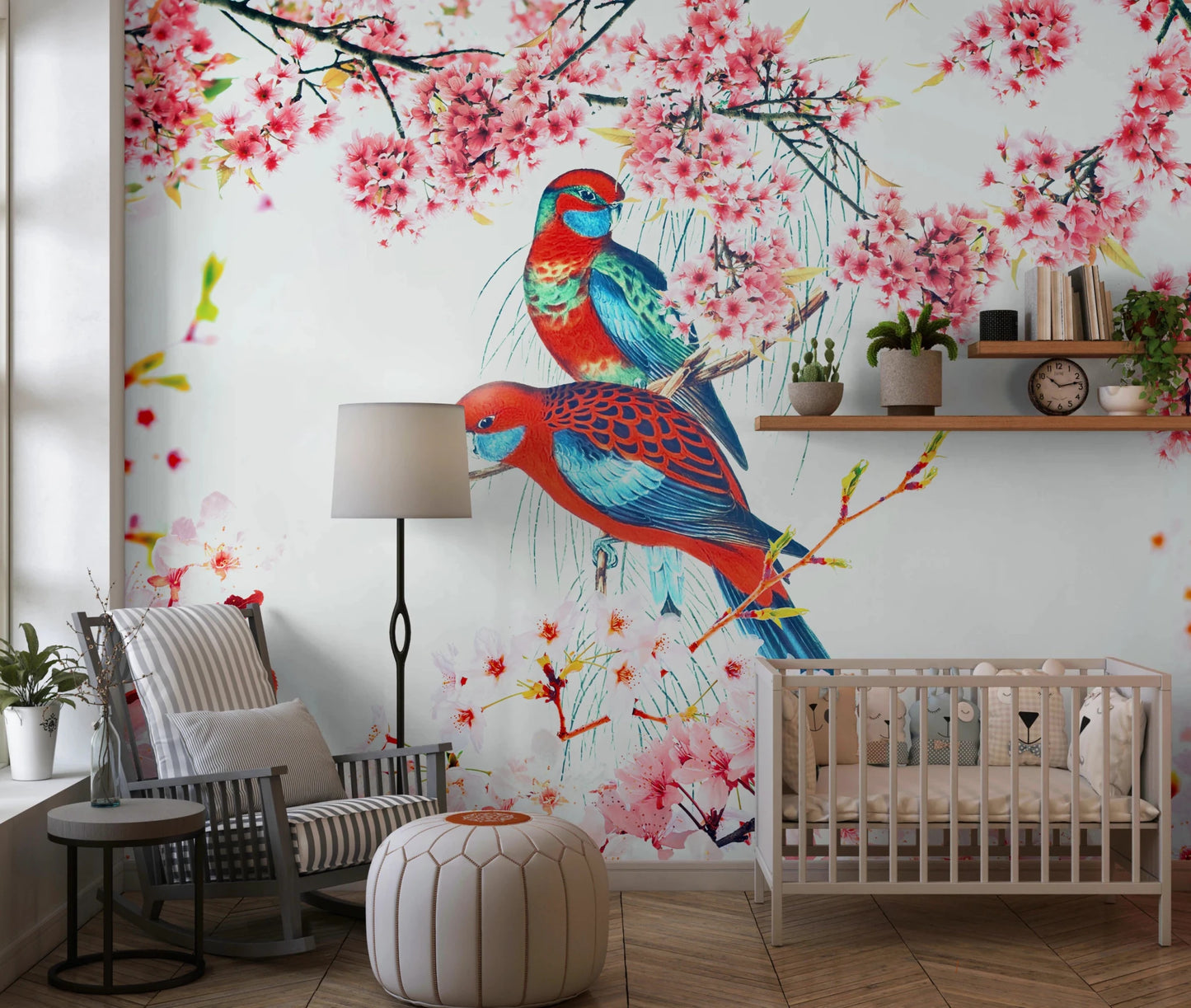 Blossom Birds wallpaper mural of parrots and cherry blossoms behind a white crib and rocking chair in a nursery