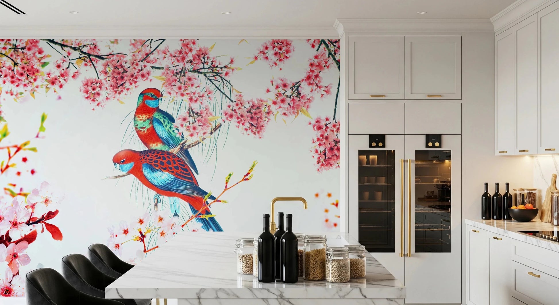 Blossom Birds wallpaper mural of parrots and pink flowers behind a white marble kitchen island and bar stools