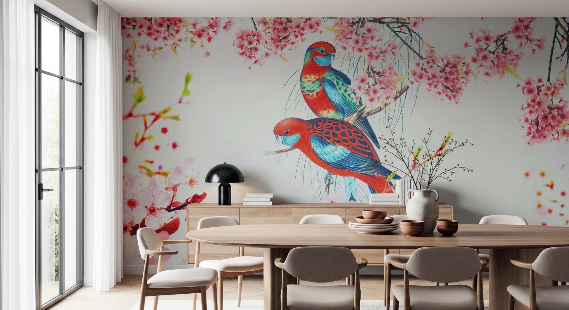 Blossom Birds wallpaper mural with colorful parrots behind a wood oval dining table and sideboard