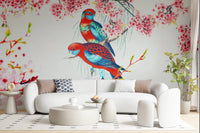Blossom Birds wallpaper mural of red and teal parrots behind a curved white boucle sofa in a living room