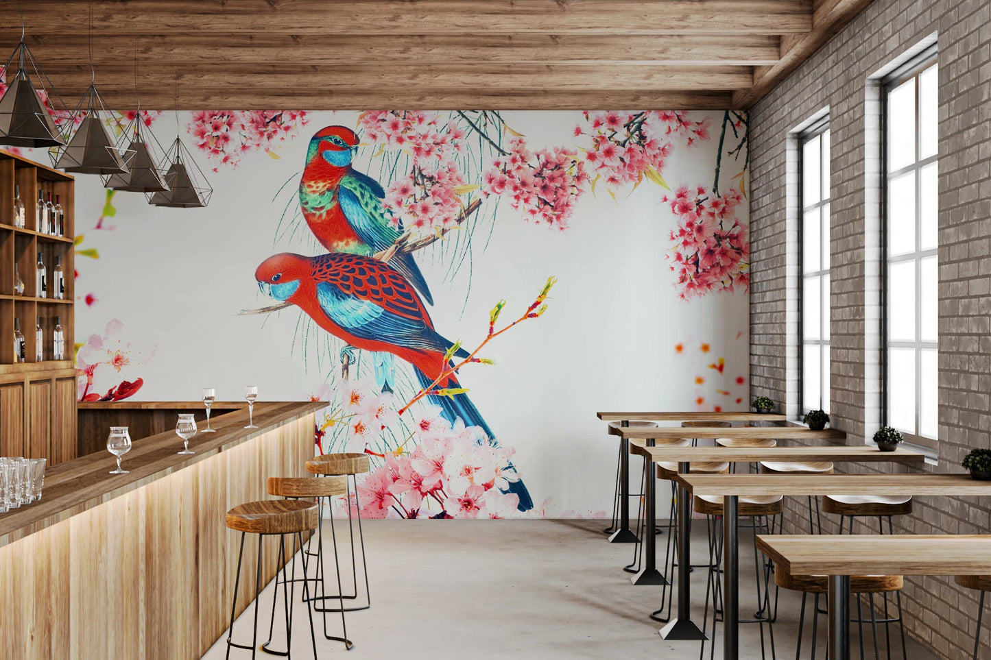 Blossom Birds wallpaper mural of parrots and pink flowers in a bar with a wood counter and exposed brick