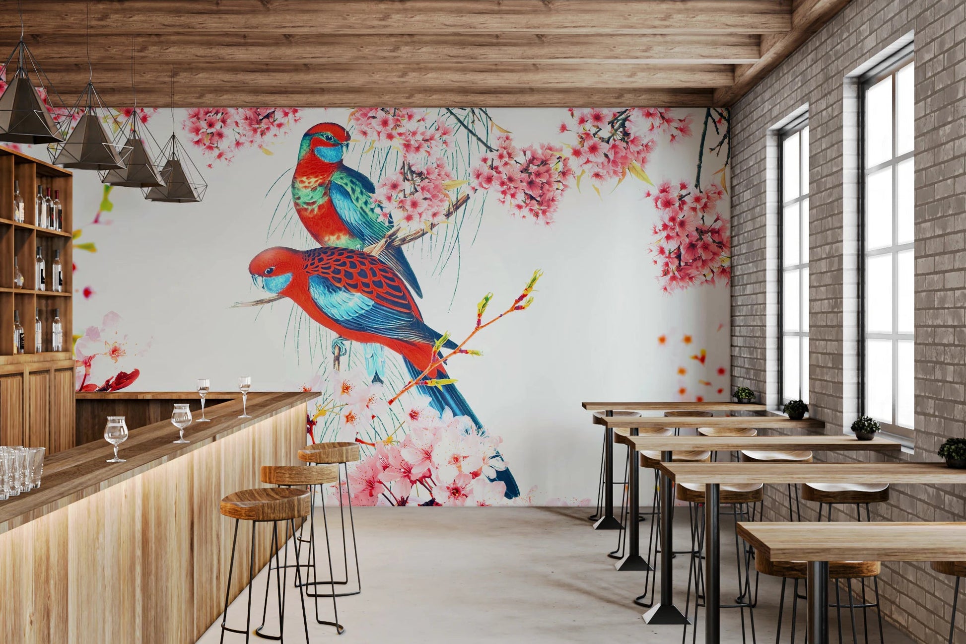 Blossom Birds wallpaper mural of parrots and pink flowers in a bar with a wood counter and exposed brick