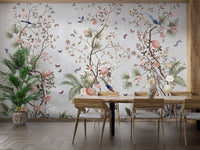 Blossoms Colorful Floral wallpaper mural styled as a feature wall behind a dining table and chairs in green tones