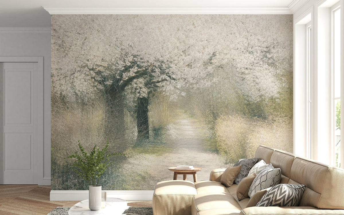 Blossom Trail wallpaper mural of a white blossom tree over a misty path behind a tan sectional sofa