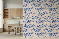 Stylized blue leaf and floral pattern creating a serene wall backdrop.