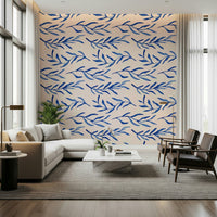 Nature-inspired wallpaper with blue flowers and leafy botanical elements.