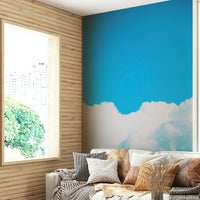 A peaceful open sky mural on decorative wallpaper.

