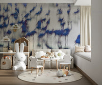 Flamingo Mirage wallpaper mural of blue flamingos in a playroom with a beige sofa and white bunny lamp