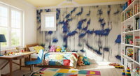 Flamingo Mirage wallpaper mural of blue flamingos behind a patchwork daybed and bookshelves in a kids room