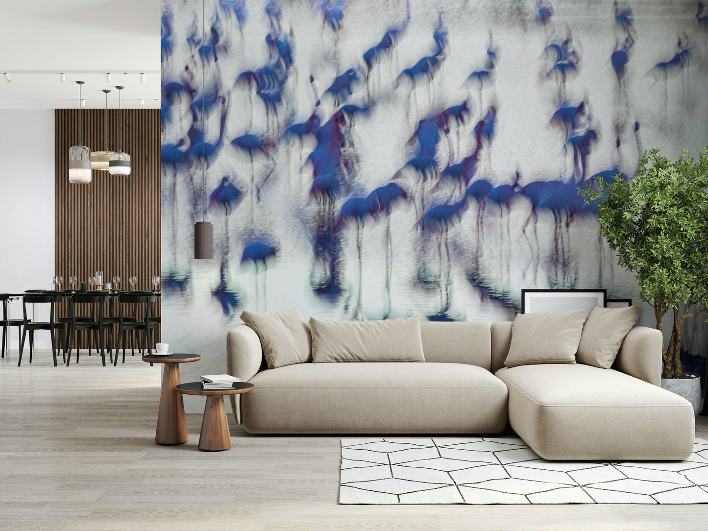 Flamingo Mirage wallpaper mural of abstract blue flamingos behind a beige sectional sofa in an open living room