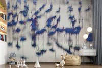 Flamingo Mirage wallpaper mural of blurred blue flamingos in a kids room with a bookshelf, plush toys and beanbag