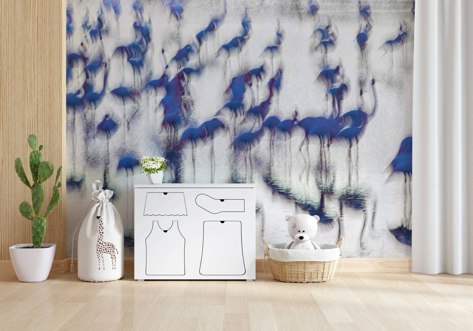 Flamingo Mirage wallpaper mural of blurred blue flamingos behind a white dresser and teddy bear in a nursery