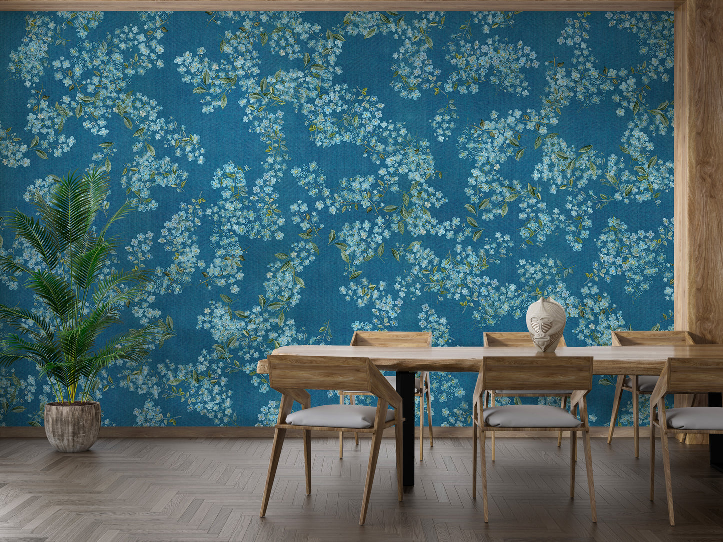 Blue Floral peel and stick wallpaper in teal with white blossoms behind a wooden dining table and chairs